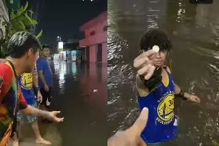 Imagen Lanzan monedas en calles inundadas de Veracruz (+video)