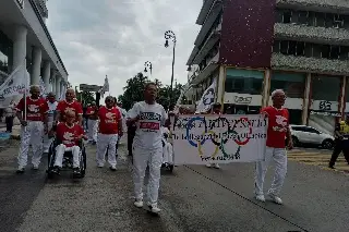 Imagen A 56 años de la llegada del Fuego Olímpico a Veracruz, realizan desfile conmemorativo