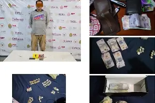 Imagen Detienen a hombre con cartuchos y fajos de billetes en Tatahuicapan, Veracruz